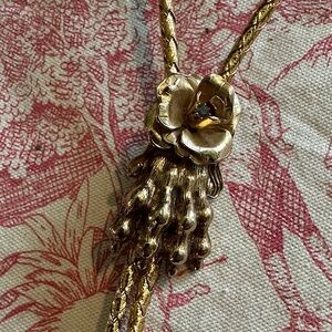 Gold Braided Bolo tie /necklace skull paw and rose with stone in center